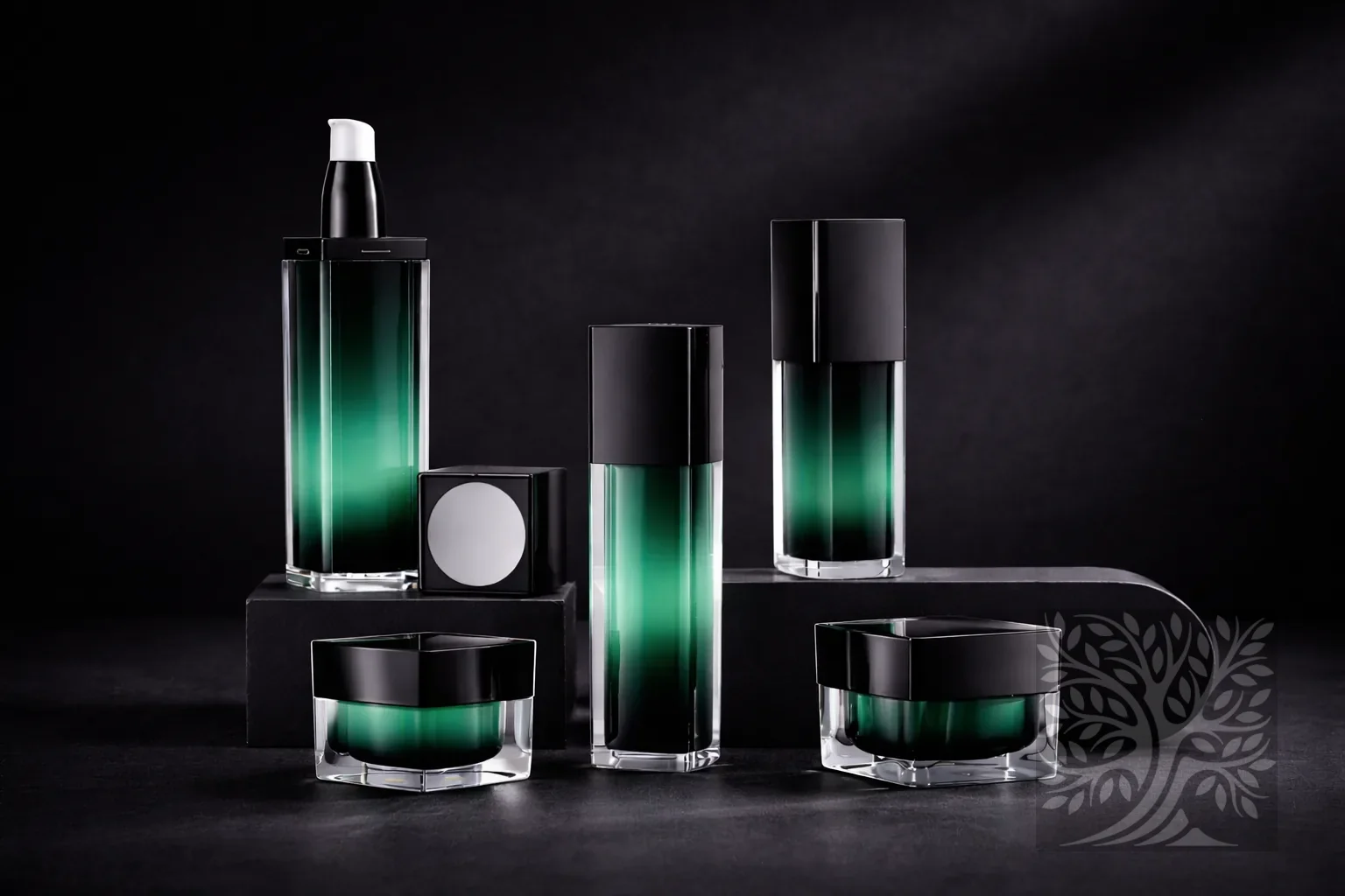 Braque collection green gradient acrylic skincare bottles and cosmetic jars with black caps, arranged on dark display blocks.